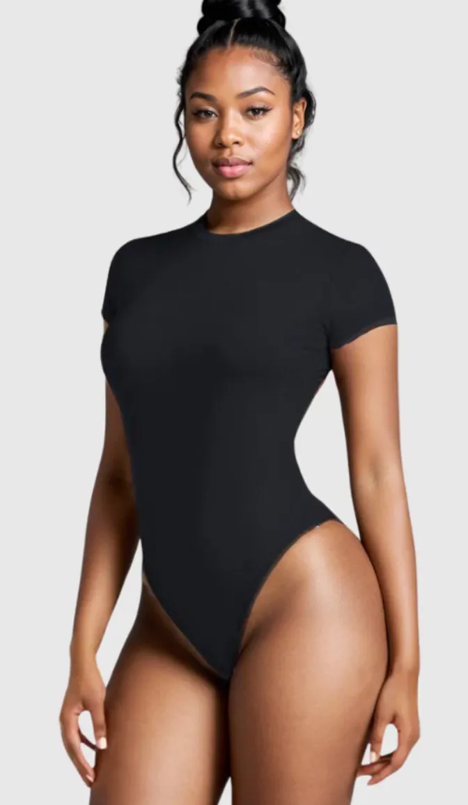 Model in a black short-sleeve bodysuit