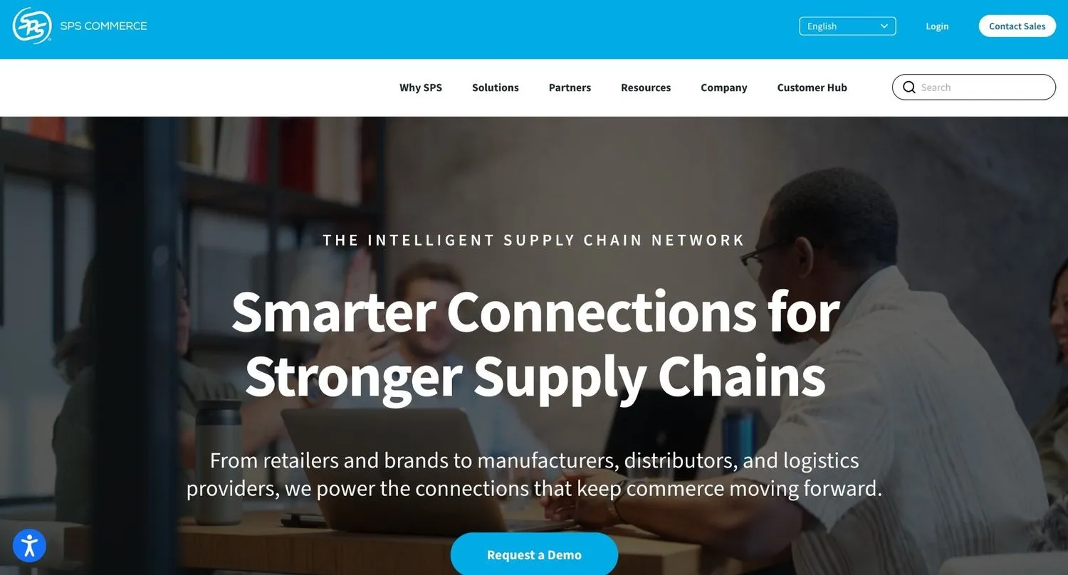 SPS Commerce homepage with a hero banner over a photo of colleagues meeting at a table