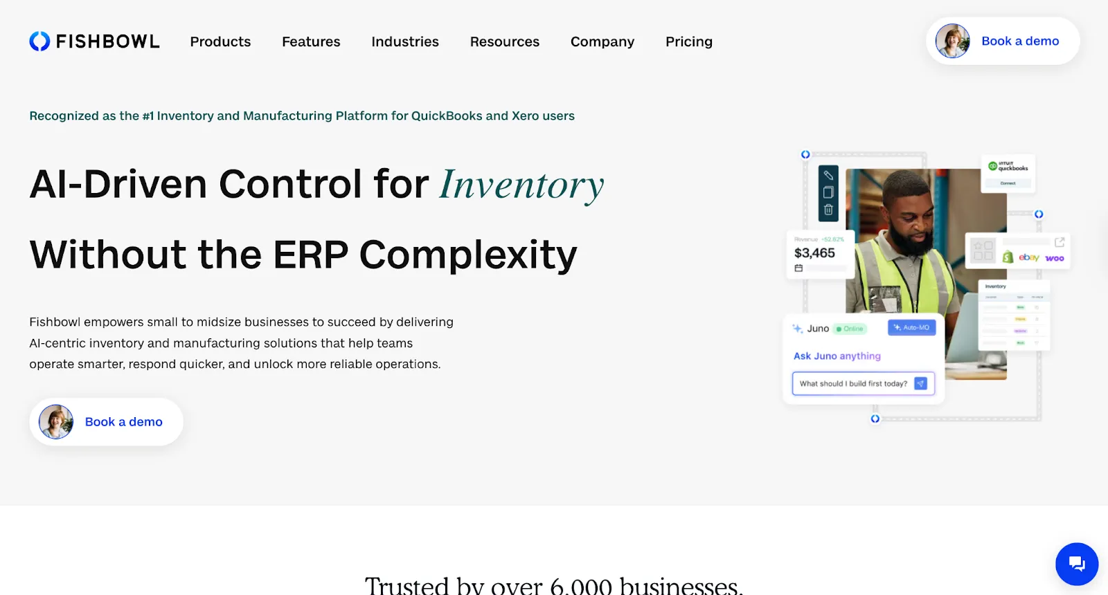 Fishbowl homepage with a warehouse worker beside revenue, inventory, and AI assistant cards