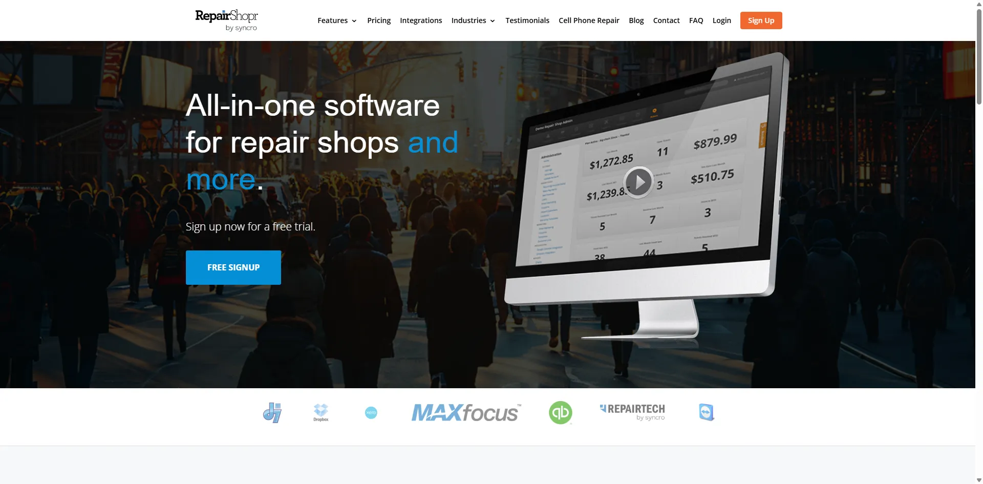 RepairShopr homepage with a desktop dashboard video over a busy city street