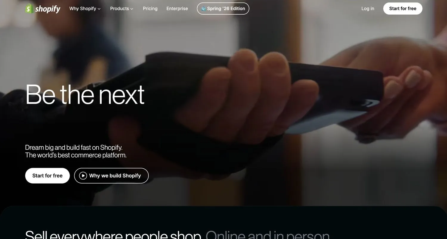 Shopify homepage with a close-up photo of hands at a payment terminal