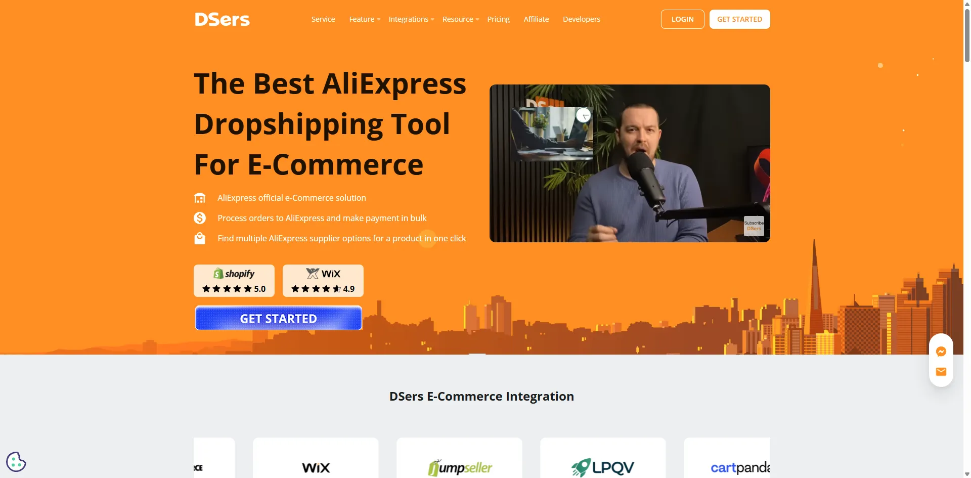 DSers homepage on an orange background with a video of a presenter at a microphone