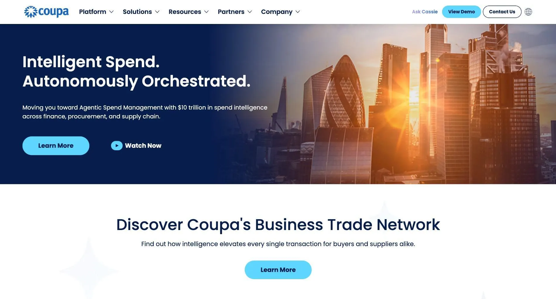 Coupa homepage with the headline "Intelligent Spend. Autonomously Orchestrated." over a city skyline, and a section on Coupa's Business Trade Network.